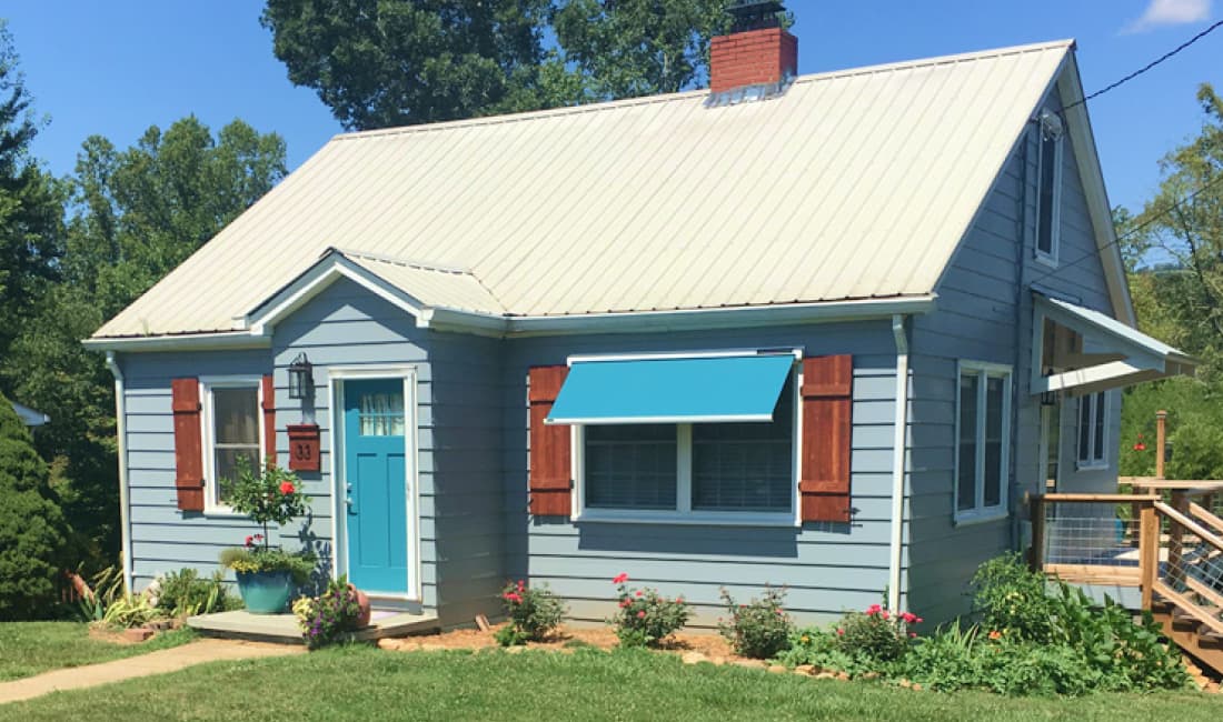 solar-powered retractable window awning installation