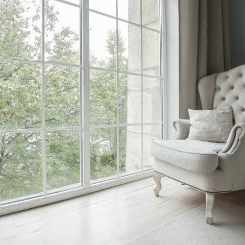 Shot of a window in a home and a chair