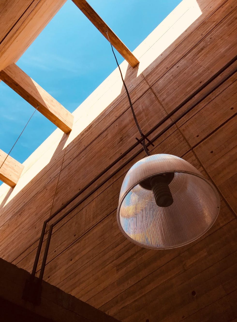 light fixture hanging from a sky tunnel