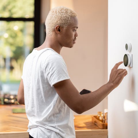 Person using their smart home tool in the wall
